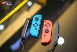 69258_may_choi_game_nintendo_switch_oled_red_and_blue_xanh_do_010.jpg 13