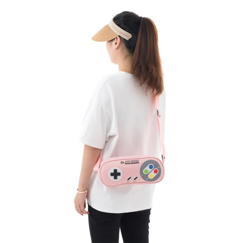 72872_tui_deo_cheo_dung_may_nintendo_switch_hinh_tay_cam_game_snes_mau_hong_2.jpg 1
